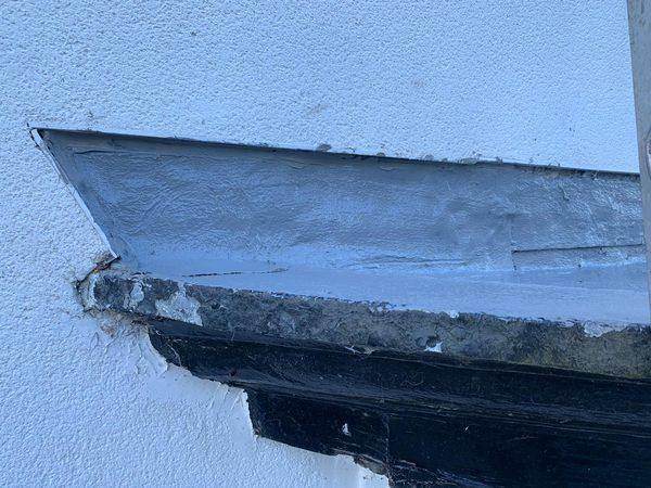 The same junction re-sealed and dressed back against the render