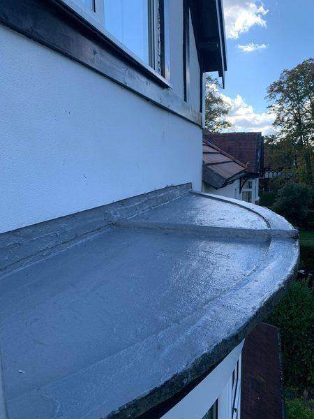 The finished curved bay sweeping round below the first-floor window