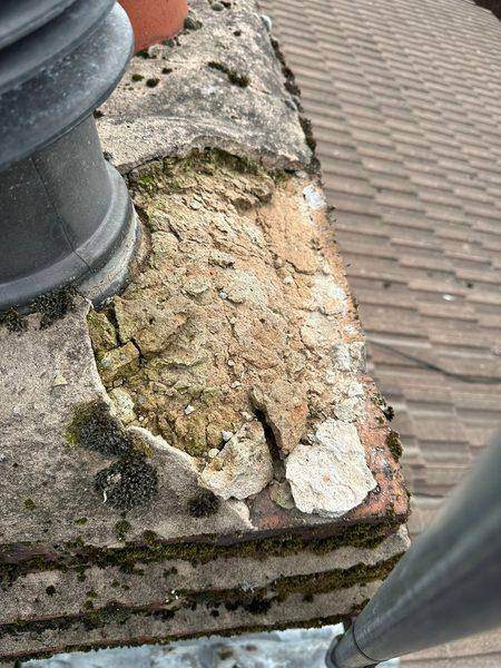 The old fillet cracked and broken away, with moss rooted in it