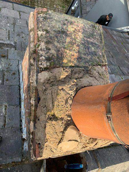 The crumbling cement crown round the base of the pot before work