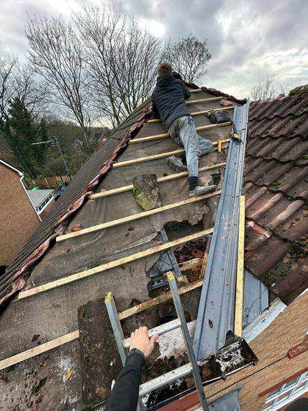 Battens going back down the stripped slope, broken cement cleared as we went