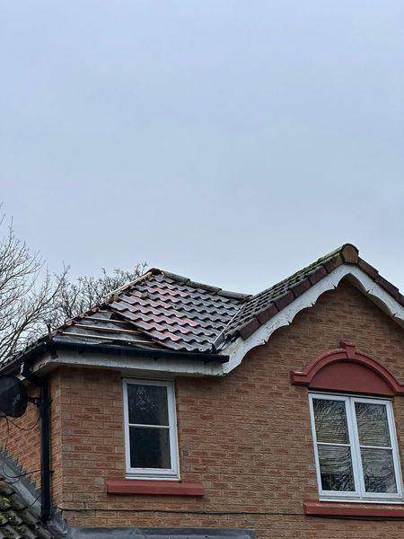 The projecting gable from the ground, valley running where the two roofs meet