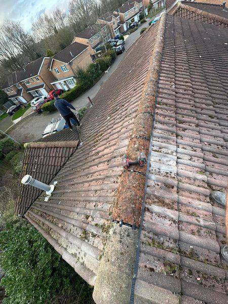 The ridge closed back up, tiles clipped and screwed down