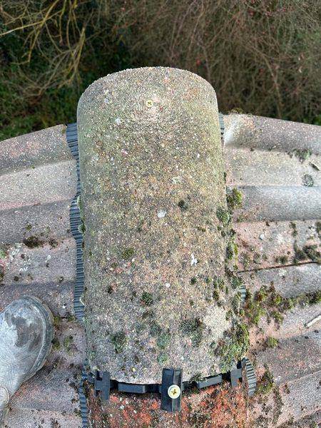 One tile seated on its union clip, screw driven home