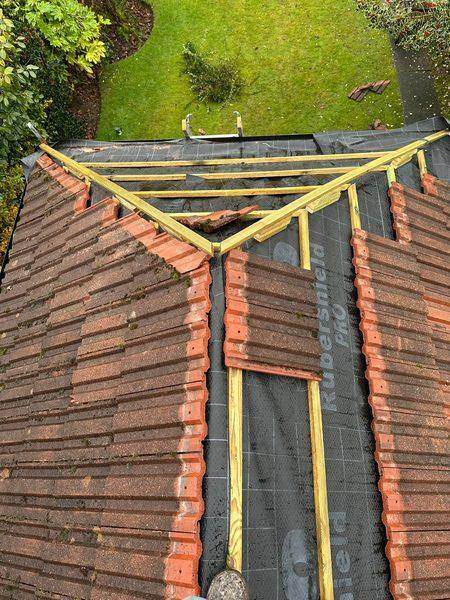 Stripped back and re-covered: new underlay and battens up to the hips