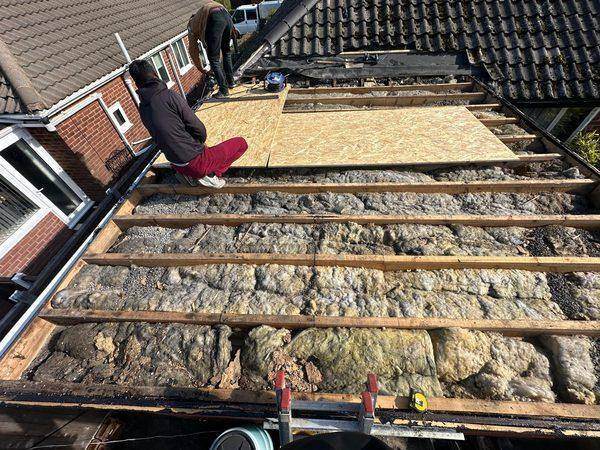 New decking sheets going down over the stripped joists