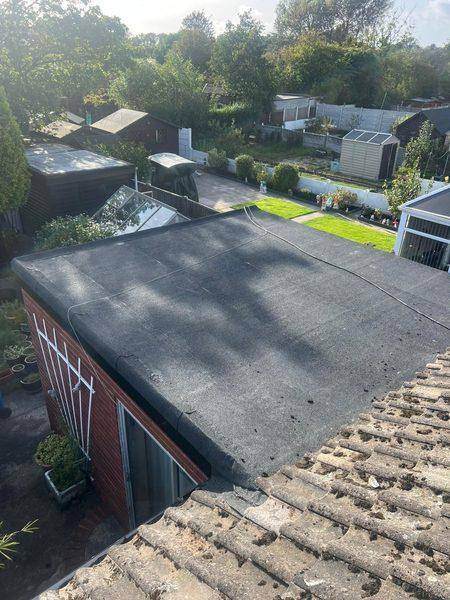 The finished felt roof seen from the main roof above the garden