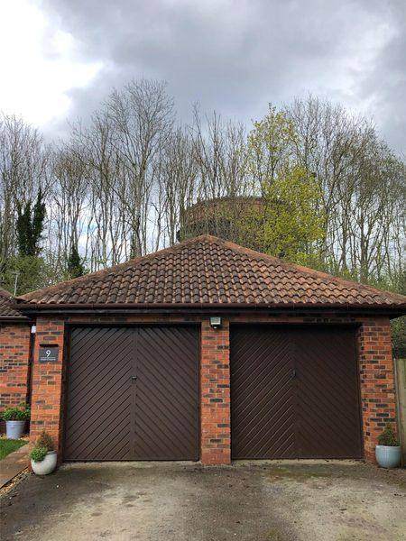 The finished garage roof, ridge and hip lines even again