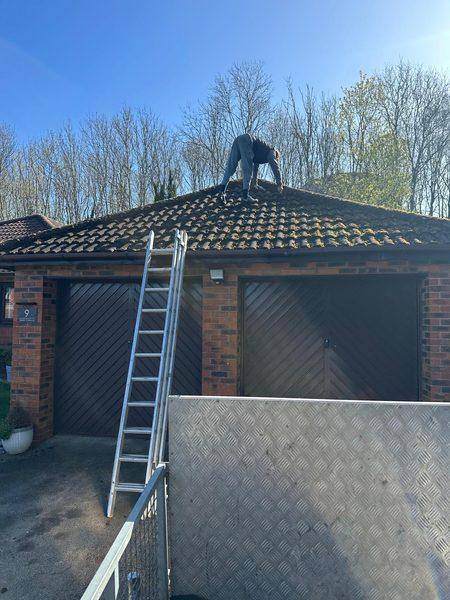 Working along the hip with the ladder up to the gutter