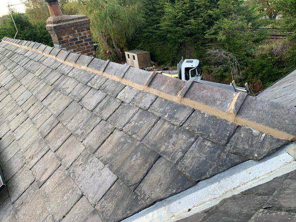 The same ridge pointed up in fresh mortar, joints closed