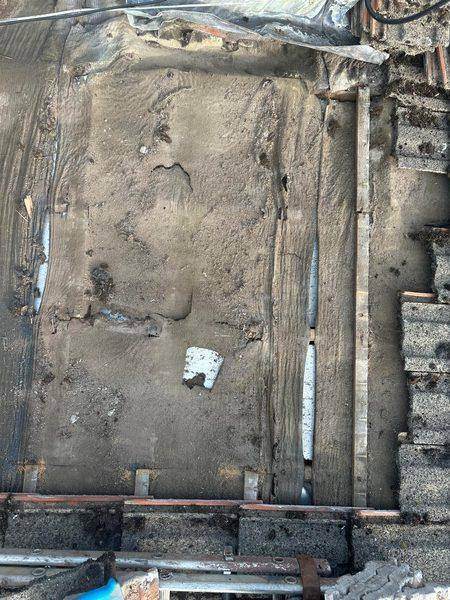 Old material cleared back between the battens before relaying
