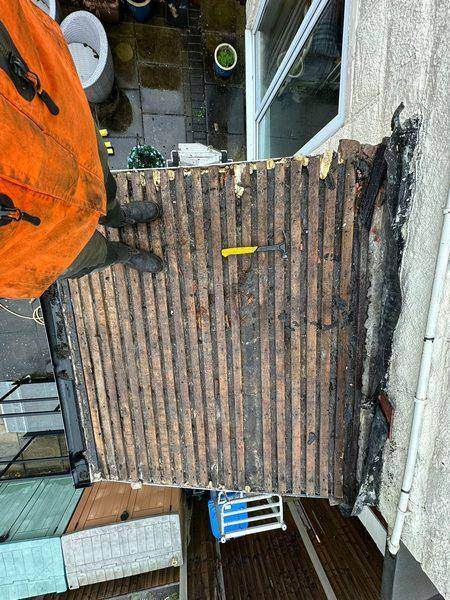 Tiles off: worn battens and what was left of the felt