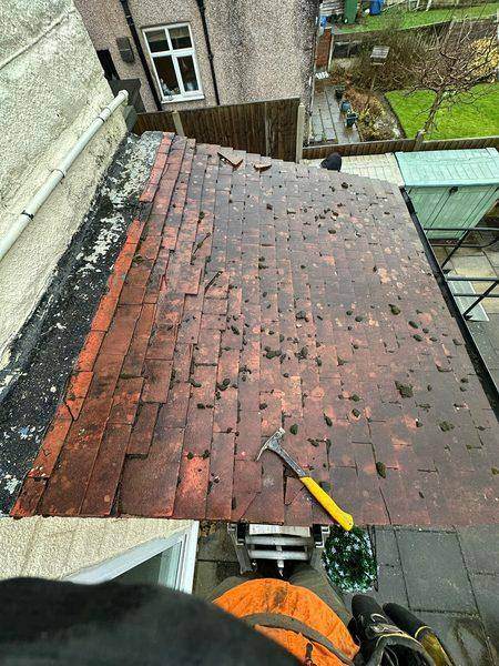 The old plain tiles on the kitchen roof before stripping began